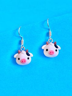 Moo Cow Face dangle earrings. Cute, quirky and eye catching.  They are lightweight and easy to wear. The hook is made of plated sterling silver to protect your ears and the Moo Cows face is made from polymer. They come well presented and wonderful for a present for a friend, family or your loved one. Thank you for taking the time to look at my earrings and please visit my shop for more original designs. Bespokedanglers.  For Fun, Funky, Quirky and original designs, please visit my shop. Besooked Novelty Hypoallergenic Sterling Silver Earrings, Novelty Sterling Silver Hypoallergenic Earrings, Hypoallergenic Novelty Sterling Silver Earrings, Playful Sterling Silver Jewelry, Nickel-free Sterling Silver Novelty Earrings, Novelty Sterling Silver Nickel-free Earrings, Nickel Free Novelty Sterling Silver Earrings, Nickel Free Sterling Silver Novelty Earrings, Quirky Hypoallergenic Dangle Jewelry