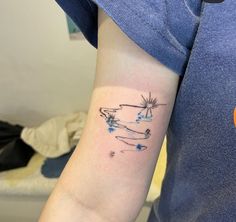 a person with a small tattoo on their arm