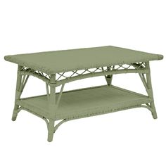 a green coffee table sitting on top of a white floor