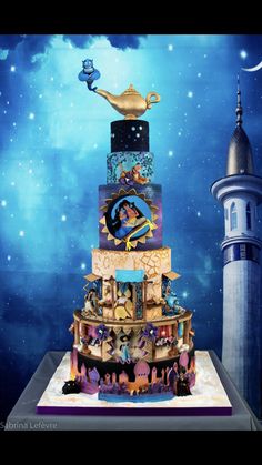 a multi - tiered cake is decorated with disney characters