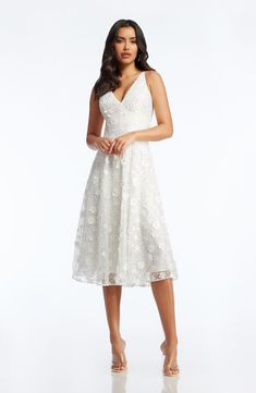 You're sure to turn heads in this gorgeous Ivory dress. Elissa features top-to-bottom white floating floral appliques and sequins. With a sleeveless, form-fitting bodice and a plunging neckline in the front and back, this dress will flatter your figure. The fit and flare silhouette is complemented by a mesh-lined, cocktail-length skirt. Ivory Dress, Ivory Dresses, Floral Applique, Beaded Dress, Plunging Neckline, Gorgeous Dresses, Classy Outfits, Appliques, Fit And Flare