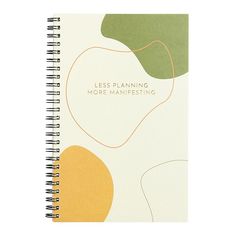 a spiral notebook with the words less planning, more managing