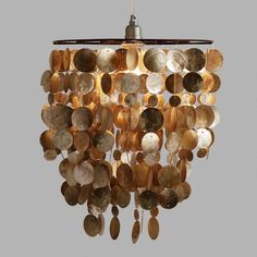 a chandelier made out of coins is hanging from the ceiling in a room