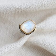 22k yellow gold bezels Rose-cut Moonstone 3 Diamonds Ring Sterling silver band Size 7 Handmade in Massachusetts 14k Gold Moonstone Ring With Gemstone Accents, Gold Moonstone Ring With Gemstone Accents, Unique Gold Moonstone Ring With Rose Cut Diamonds, Gold Moonstone Ring With Gemstone Accents For Anniversary, Handmade Yellow Gold Moonstone Ring Fine Jewelry, Handmade Yellow Gold Moonstone Ring, Handmade Fine Jewelry Yellow Gold Moonstone Ring, Gold Rings With Gemstone Accents And Moonstone, Gold Moonstone Rings With Gemstone Accents