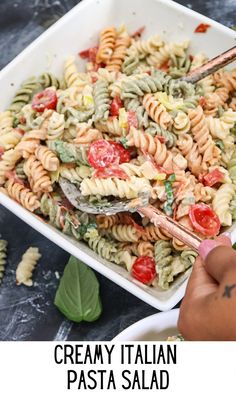 this creamy italian pasta salad is loaded with fresh tomatoes, basil and mozzarella