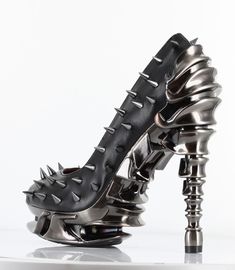 Add a touch of edge to your wardrobe with these bold and stylish black spiked platform heels, designed for women with a passion for gothic fashion. these multi-piece heels feature an open toe design and a spinal heel that will make you stand out from the crowd. Hades Footwear, Steampunk Shoes, Alternative Shoes, Goth Shoes, Diesel Punk, Gothic Shoes, Unique Shoes, Platform High Heels, Black High Heels