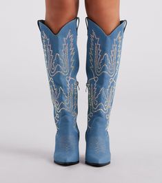 Unveil your glamorous country style in these must-have denim cowboy boots perfect for a rodeo or country festival! They feature a pointed toe. side zipper closure. classic western-inspired stitching with sparkly iridescent rhinestone embellishments. and a stacked block heel. Complete the look in a trendy hat.Fit & Features Pointed toe Side zipper closure Western-inspired stitching Iridescent rhinestone embellishments Stacked block heel Denim material Runs true to size Western Boots With Rhinestones For Spring, Western Denim Boots For Rodeo, Western Boots With Zipper Closure, Western Fitted Boots With Zipper Closure, Western Boots With Zipper Closure For Spring, Fitted Western Boots With Zipper Closure, Blue Rhinestone Boots For Fall, Denim Cowboy Boots, Rhinestone Cowboy Boots