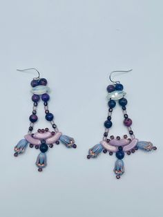 These earrings are sweet and feminine. They dance around the face! Each piece of jewelry listed at Je Suis Courtenay is handmade with supplies sourced by me, and each is a one of a kind unique item. These will not be restocked! If you love to stand out you're in the right place. Artisan Dangle Earrings For Party, Unique Adjustable Chandelier Dangle Earrings, Unique Chandelier Drop Earrings With Dangling Beads, Artisan Chandelier Dangle Earrings For Pierced Ears, Gift Drop Chandelier Earrings With Dangling Beads, Gift Chandelier Drop Earrings With Dangling Beads, Artisan Adjustable Dangle Chandelier Earrings, Artisan Adjustable Chandelier Dangle Earrings, Adjustable Chandelier Earrings As Gift