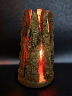 a candle that is lit up in the dark