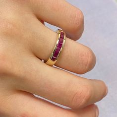 Clean And Simple This Fabulous Channel Set Band Ring Is Set With 7 Pink Rubbies Which Been Carefully Hand Matched. Total Carat Weight: Aprox. 0.84. Width Of The Ring Is 4.23mm. Crafted In 14k Yellow Gold. Ring Size 6. Weight: 4.30 Grams. Comes With A Presentable Gift Box. Id: 049699 Ruby Diamond Ring With Vvs Clarity And Baguette Cut, Ruby Ring With Channel Set Diamonds In Yellow Gold, Yellow Gold Ruby Ring With Channel Set Diamonds, Fine Jewelry Ruby Ring With Diamond Channel Set, Ruby Ring With Vvs Clarity And Baguette Cut, Fine Jewelry Diamond Channel Set Ruby Ring, Luxury Ruby Ring Channel Set For Anniversary, Anniversary Ruby Jewelry Channel Set, Ruby Channel Set Jewelry For Anniversary