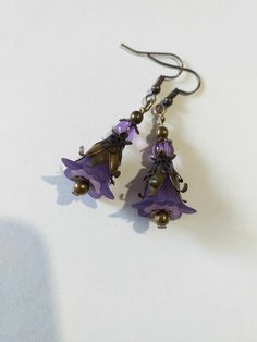 Purple Victorian bronze flower earrings lavender flower set necklace earrings Purple flower earrings Boho bronze earrings gift Gorgeous Victorian style jewelry set necklace and earrings . Bohemian necklace and earrings . Beautiful Set of bronze-tone Antique style lavender purple plastic flowers  and beautiful ornamented caps necklace and earrings. Bronze Victorian style necklace and earrings. Boho necklace. Bohemian necklace and earrings. Romantic necklace and earrings. Royal style jewelry set. Baroque style jewelry set. Antique style jewelry set. Gothic style jewelry set.  Perfect Gift for girlfriend,  mother,  sister,  bridesmaids or Maid of honor. Gift for special people or jewelry set for your special occasion. You may choose from the options menu from: earrings,  jewelry set necklace Bohemian Brass Flower Earrings, Handmade Purple Metal Earrings, Lavender Bohemian Dangle Jewelry, Bohemian Metal Jewelry With Flower Charm, Adjustable Copper Flower Jewelry, Lavender Flower Jewelry For Pierced Ears, Vintage Purple Flower Earrings, Bronze Flower-shaped Jewelry Gift, Purple Brass Drop Earrings