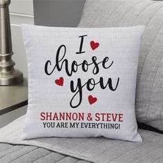 a pillow that says i choose you and has hearts on the front, with an image of