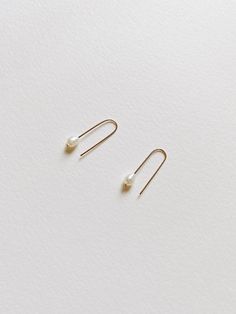 + PEARL U HOOP THREADER EARRINGS +Tiny Fresh Water pearl threader in U shape made with 14k Gold-filled wires. A small drop dangle on your ears that are modern & classic. + Fresh water pearls 4mm+ 14k Gold-filled wire+ Listing is for 1 pair of earrings+ Please allow 5-7 business days to ship out. Minimalist 14k Gold Filled Threader Earrings, Minimalist 14k Gold Dangle Pearl Earrings, Minimalist Everyday Pearl Earrings, Minimalist Pearl Earrings For Everyday, Minimalist Pearl Drop Earrings For Everyday, Minimalist Pearl Earrings With Ear Wire, 14k Gold Pearl Earrings For Everyday, Minimalist 14k Gold Filled Teardrop Pearl Earrings, Minimalist Rose Gold 14k Gold-filled Threader Earrings