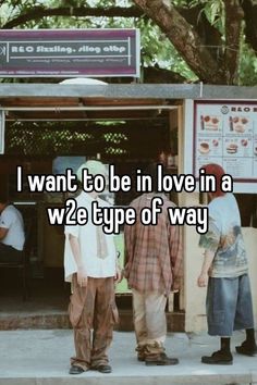 three men standing in front of a food cart with the words i want to be in love