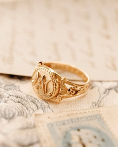 The Marie Antoinette Ring her monogrammed rIng MA, she was the queen of France brfore the French Revolution.  This beautiful ring made of 18k gold plated silver and inscribed inside Eat Cake. All items come in a gift box ready to gift. To see more please visit my Etsy shop at https://www.etsy.com/shop/BijouLimon Bijou Limon jewelry collections present a romantic French spin on the latest jewelry trends. Based on the US West Coast but French at heart, Bijou Limon interprets the current jewelry tr Antique Engraved Rings For Marriage, Heirloom Engraved Ring Stamped 14k For Marriage, Elegant Ceremonial Signet Ring With Engraving Option, Antique Engraved Round Ring For Marriage, Victorian 14k Gold Signet Ring With Initials, Antique Signet Ring As Gift, Victorian Gold Signet Ring With Initials, Victorian Engraved Rings For Marriage, Antique Personalized Signet Ring For Anniversary