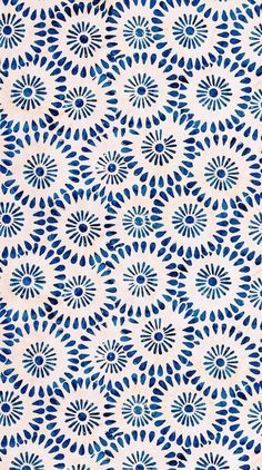 an abstract blue and white pattern on fabric