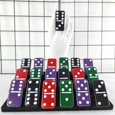 a hand is reaching for dominos on a board game