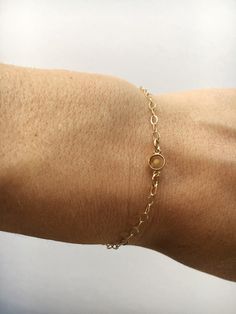 Dainty mustard seed bracelet with cable chain and mini link pendant. Mustard seed preserved in resin. A sweet reminder to keep the faith!! Minimalist Gold Chain Bracelet With Birthstone, Dainty Gold Chain Bracelet With Birthstone, Mustard Seed Jewelry, Mustard Seed Necklace, Gold Tennis Bracelet, Remembrance Jewelry, Faith Jewelry, Bracelet Dainty, Keep The Faith