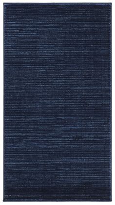 a dark blue rug with vertical stripes