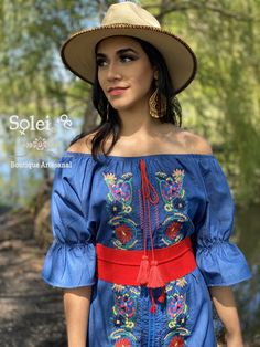 This Beautiful Off the Shoulder Mexican Campesino Dress is the perfect Spring & summer dress. It's lightweight with elastic around the shoulder, made out of a light jeans material and is full of vibrant colors.the belt shown with this dress is included.Denim floral dress Embroidered Denim Dress, Mexican Embroidered Dress, Mexican Fashion, Mexican Outfit, Mexican Dress, Mexican Women, Floral Jeans, Light Jeans, Mexican Dresses