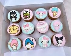 twelve cupcakes in a box decorated with cartoon characters