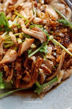 a close up of a plate of food with meat and veggies on it