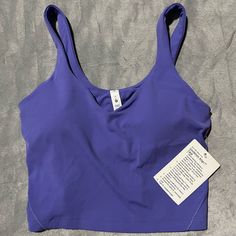 Nwt, I Got This As A Gift So The Price Is Cut Off But It Is Too Small For Me. Super Cute Color - It’s Like A Blueish Purple Purple Activewear With Built-in Bra For Light Exercise, Casual Purple Sports Bra For Yoga, Casual Purple Sleeveless Sports Bra, Purple Sleeveless Top With Medium Support, Medium Support Purple Sleeveless Top, Purple Seamless Sporty Top, Casual Purple Sports Bra With Moisture-wicking, Casual Purple Moisture-wicking Sports Bra, Functional Fitted Purple Tops