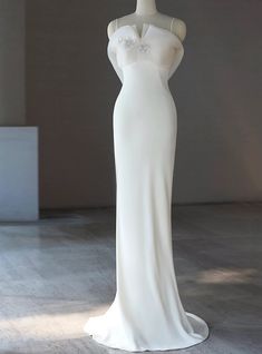 a white dress on display in a room