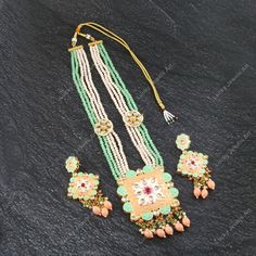 This is a stunning handmade necklace perfect for high end Jewelry Collector, a keeper in Traditional Vintage Indian/Pakistani Bridal jewelry and a Luxury Gift for your Daughter, Sister or Wife on Wedding or Anniversary. Perfect for any type of occasions, weddings And celebrations and a beautiful & memorable gift for weddings and special occasions. - Item Code:- L -Aqua green & peach beaded Necklace Set with Earrings. -Designer multi layered faceted peach & green beaded necklace. -Gold Plated Set with Kundan Stones which shine like Polki Diamonds. -Metal: Gold plated brass -Earrings are 95mm long & 45mm wide approx -Push Back Earrings -Necklace length with pendant 11.5" approx including adjustable dori/cord -Quantity - One Necklace Set Please see more different designs here:- https://www.et Luxury Meenakari Bridal Necklace Pendant, Luxury Bridal Meenakari Pendant Necklace, Luxury Meenakari Pendant Bridal Necklace, Luxury Meenakari Beaded Bridal Necklace, Pakistani Bridal Jewelry, Kundan Necklace Set, Vert Turquoise, Green Beaded Necklace, Polki Necklace