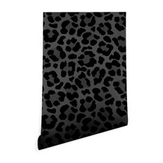 a black and white leopard print wallpaper with an animal pattern on it's side