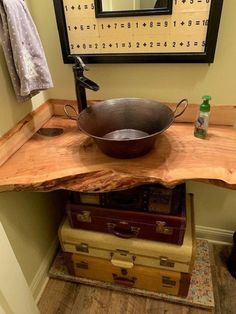 a wooden table with a metal bowl on it