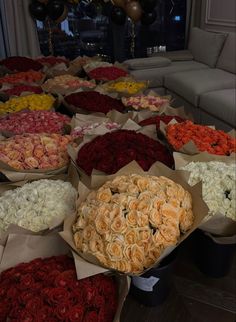 large bouquets of roses are arranged on the table