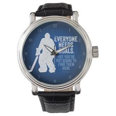 a watch with an image of a man holding a hockey stick on the front of it