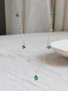 custom order 5-6 weeks  length 42cm (adjustable at 40cm)  crystal 4x 6.5mm  green crystal 3mm  clear crystal 2mm  ITEM CAN NOT BE RETURNED  Material: 14 karat. Only solid gold. NO gold filled / NO gold plating   Gold Info:  24K gold is 100% pure 18K contains 75% gold and 25% alloyed metals 14K is 58.5% gold and 41.5% alloyed metals 9K contains 9 parts pure gold and 15 parts additional metals such as silver, tin, nickel, zinc, palladium, etc. ----------------------------------------------------------------------  quality, simplicity, reasonable price For questions or inquiry please do not hesitate to contact us. We will be happy to assist you.  SHIPPING: 1. Shipping takes approximately 3-5 business days (exclude weekend and holiday) for domestic customer.  Shipping via USPS five days a week Green Charm Necklace With Dangling Charms For Gift, Green Dangle Charm Necklaces, Green Dangle Charm Necklace, Everyday Green Emerald Pendant Necklace, Elegant Green Sterling Silver Charm Necklace, Delicate Green Sterling Silver Necklaces, Green Necklace With Dangling Charms As Gift, Green Necklace With Dangling Charms For Gift, Green Necklaces With Dangling Charms As Gift