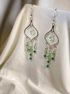 Stand out with these beautiful crystal earrings! Made with genuine Swarovski beads, they have a shine unlike any other bead. Wear to a formal event or with jeans and a T-shirt to jazz up any outfit. Long Beaded Earrings, Earrings Fancy, Earrings Prom, Green Gradient, Prom Earrings, Fancy Earrings, Swarovski Beads, Earrings Crystal, Swarovski Crystal Earrings