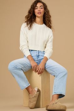 This cable-knit crop sweater is perfect for layering over your favorite dresses or rocking with jeans. This effortlessly chic pullover adds a touch of texture to your fall wardrobe. Cropped Sweater Outfit Fall, Cropped Sweater Outfit, Cable Knit Sweater Outfit, Football Dress, White Sweater Outfit, Cute Sweaters For Fall, Knit Sweater Outfit, Family Picture Outfits, Skirts With Boots