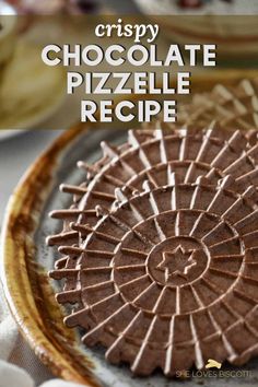 a chocolate pizza on a plate with the words crispy chocolate pizzelle recipe