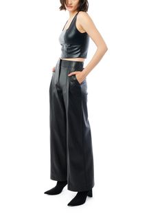 Crafted with exquisite attention to detail, these luxurious LBLC Clark Wide Leg Vegan Leather Trousers lend a timeless elegance to all your outfits. Their versatile styling features a high-rise fit with pleated front and wide leg for a flattering, statement silhouette. Crafted with side pockets and a hidden zipper, these trousers are secured with a hook and bar closure for a perfect fit that works just as well with an oversized sweatshirt, as they do with your favorite "going out top"! **Sizing Bar Fronts, Faux Leather Fabric, Going Out Tops, Wide Leg Pant, Leather Trousers, Leather Dresses, Oversized Sweatshirt, Leather Fabric, Festival Wear