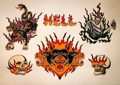 several stickers with different designs on the back of them, including skulls and flames