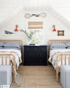 there are two beds in this attic bedroom