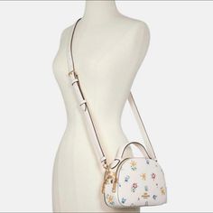 New With Tag! Authentic Coach Serena Satchel With Wild Meadow Print Chalk: Crossbody Bag Come With Original Package From Coach Refined Pebbled Leather Inside Multifunction Pocket Double Zip Closure, Fabric Lining Handle With 2" Drop Outside Slip Pocket Detachable Strap With 21" Drop For Shoulder Or Crossbody Wear 8 1/4" (L) X 5 3/4" (H) X 2 1/2" (W) Ship Next Day! Coach Serena Satchel, White Bag With Detachable Strap For Day Out, Coach Bags For Daily Use In Summer, White Bag With Detachable Handle For Spring, White Top Handle Bag For Spring, Spring Casual Coach Bags, White Feminine Bags For Summer, Feminine White Bags For Summer, Coach Bags With Detachable Handle For Spring