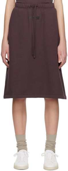 Cotton-blend fleece skirt. · Drawstring at elasticized waistband · Two-pocket styling · Rubberized logo patch at front Supplier color: Plum Fleece Skirt, Fear Of God Essentials, Fear Of God, Patch Logo, Apparel Accessories, Plum, Midi Skirt, Top Brands, Cotton Blend