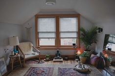 a living room filled with furniture and a large window