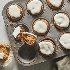 cupcakes with white icing in a muffin tin