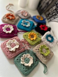 small crocheted purses sitting on top of a table