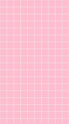 a pink tiled wall with white squares on it