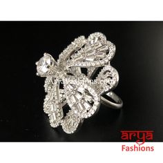 Elegant Cubic Zironia Flower Silver Ring Features: Adjustable Ring to match any finger size Made in Brass with Rhodium finish Lightweight Jewelry Width: 1 Inch Very high quality Cubic Zirconia stones. Suitable for any occasion and traditional or Modern attire Ready to ship and available for local pickup from 23059. Please message us for more details Free shipping on orders above $75 within USA. Light Weight Jewelry, Adjustable Ring, Adjustable Rings, Colored Diamonds, Diamond Bracelet, New Product, Heart Ring, Silver Ring, 1 Inch