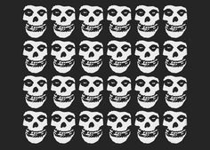 a bunch of skulls that are in the shape of faces on a black and white background