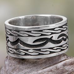 Named after the Balinese beach town this wide sterling silver band ring is dramatic yet elegant. Indonesian artisan Nyoman Ariawan hand-crafts his ring design with wave and ocean motifs and a combination finish. Mens Silver Ring, Colored Diamond Jewelry, Delicate Gold Jewelry, Mens Sterling Silver Necklace, Engraved Bangle, Silver Ring Band, Bali Jewelry, Mens Rings Fashion, Silver Ring Designs