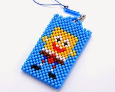 a beaded keychain with an image of the simpsons character on it's face